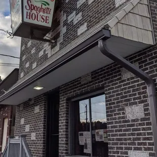 Outside - there is a handicap ramp entrance on the side.