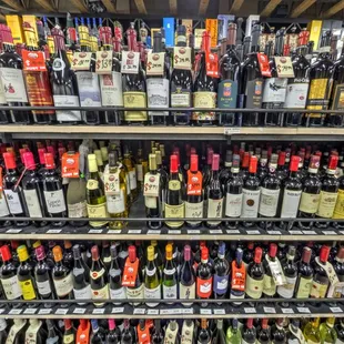 rows of wine bottles in a store