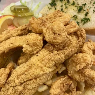 Half fried shrimp, half fried fish plate. Fries, salad and garlic bread comes with. $13.
