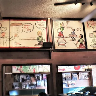 The origin-story artwork on the wall is very charming