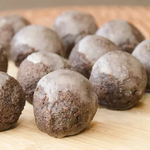 a pile of chocolate donuts