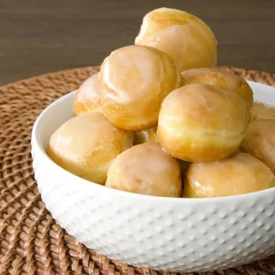 a bowl of glazed donuts