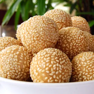 a bowl of sesame balls