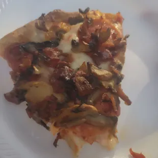 Large pizza with pepperoni, bacon and mushrooms! The bacon is crispy and delicious