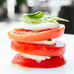 Caprese (stack of tomato, fresh mozzarella, &amp; basil, topped with salt, pepper and EVOO)