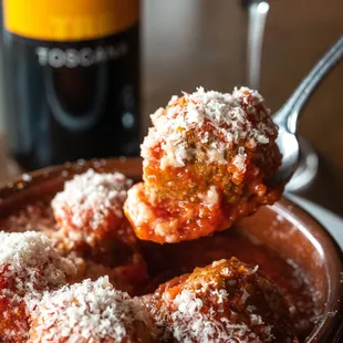 House baked meatballs in tomato sauce, topped with freshly grated parmesan.