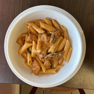 a bowl of penne with sauce