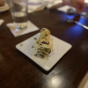 Canoli: drizzled with white chocolate and crushed pistachio