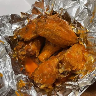 chicken wings wrapped in foil