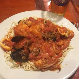 a plate of pasta and seafood