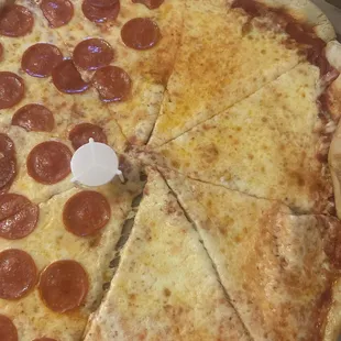 Pizza looks good but slightly crushed. Lifted one slice to see the pool of oil.