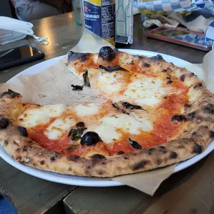 Margherite pizza (with a slice eaten)