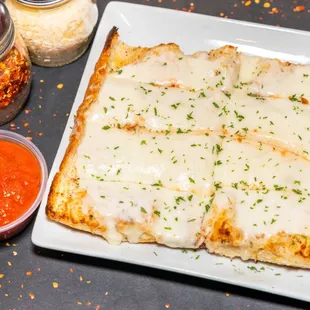 Garlic cheeze bread.  Eight yummy pieces before your pizza.  Dip it into ranch, meat or marinara sauce.