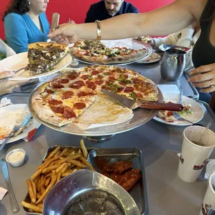 pizzas 18&quot; with half supreme and half Philly and 18&quot; with all pepperoni and half jalapeño.