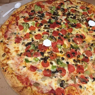Biggest pizza ever! Just look at the plastic spoon!