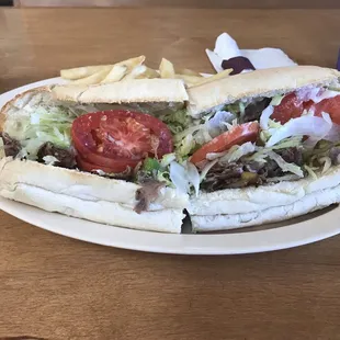 The 10&quot; Napoli steak and cheese with lettuce, tomato, green peppers, onions, mushrooms, and mayo