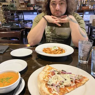 Pizza slice, shrimp bisque, and GF pasta bolognese