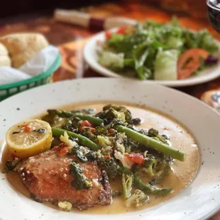 Salmon with fresh veggies sautéed  in a lemon butter sauce