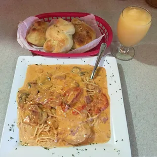 This is the Chicken Carbanara!chicken,ham,tomatoes, and mushrooms in creamy alla panna sauce served over spaghetti