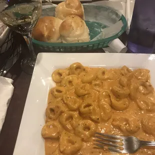 Rolls, wine, tortellini alla panna