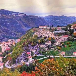 a view of a village in the mountains