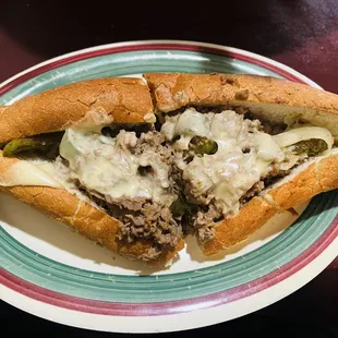 a meat and cheese sandwich on a plate