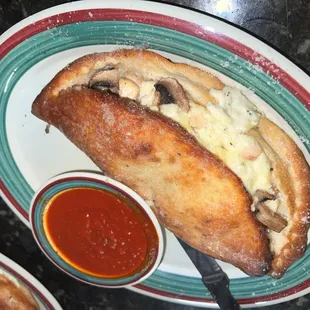 a plate of pizza and sauce