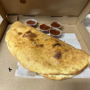 Biggest Deluxe calzone I have ever had! Delicious cheese inside!