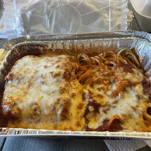 Lasagna and a side of baked spaghetti.