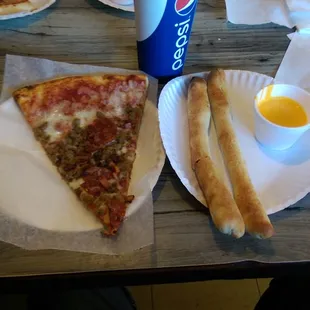 Delicious  $ 5.75 lunch special , meat lover&apos;s slice, pepperoni breadsticks with cheese sauce and a fountain drink. WoW !