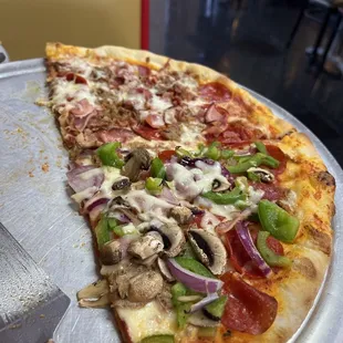 Half deluxe and half meat lovers...half eaten.