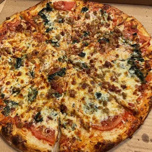 Spinach Florentine Pizza with bacon and sausage. So yummy!!