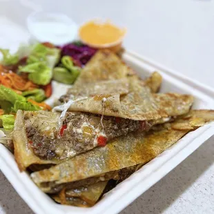 Gözleme: Turkish Flatbread stuffed w/ ground beef, cheese | $10.95 (includes garden salad &amp; pickled red cabbage)