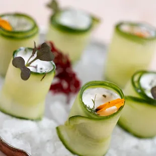 a platter of cucumber rolls