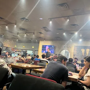 a large group of people sitting at tables