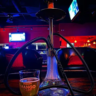 a glass of beer and a hook