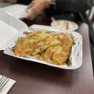 a plate of omelets and a fork