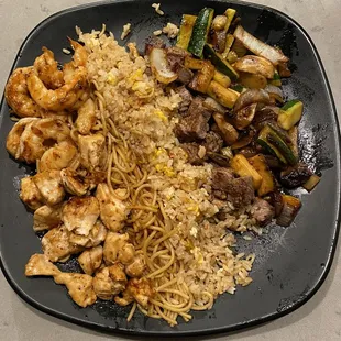 Filet, chicken and shrimp - it comes with veggies (zucchini, onions and mushrooms), noodles and rice (I upgraded to fried rice)
