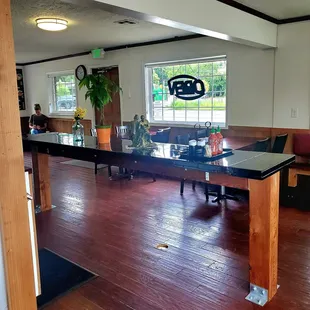a dining room with a table and chairs