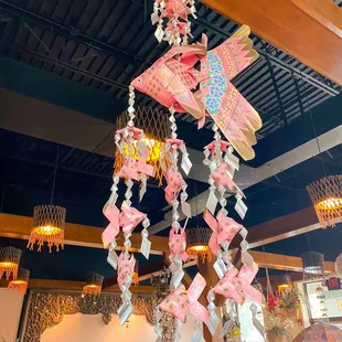 a person standing under a chandelier