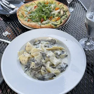 Chicken pesto pizza and wild mushroom pasta. We always get this!