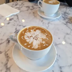 Cappuccino and Irish cream mocha. Cute milk foam art!!