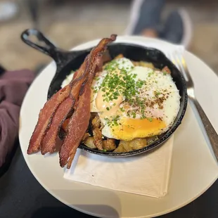 bacon and eggs in a skillet