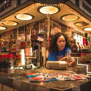 a woman behind the counter