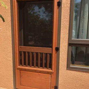 Spanish Cedar screen door, raised panel and latilla detail.