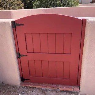Painted entry gate, arch top.