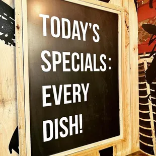 a sign that says today's specials every dish