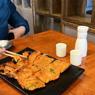 a woman eating at a table