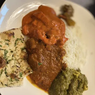 Butter chicken, vindaloo lamb,  saag paneer and garlic naan. Heavenly!