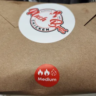 a pizza box with a sticker on it